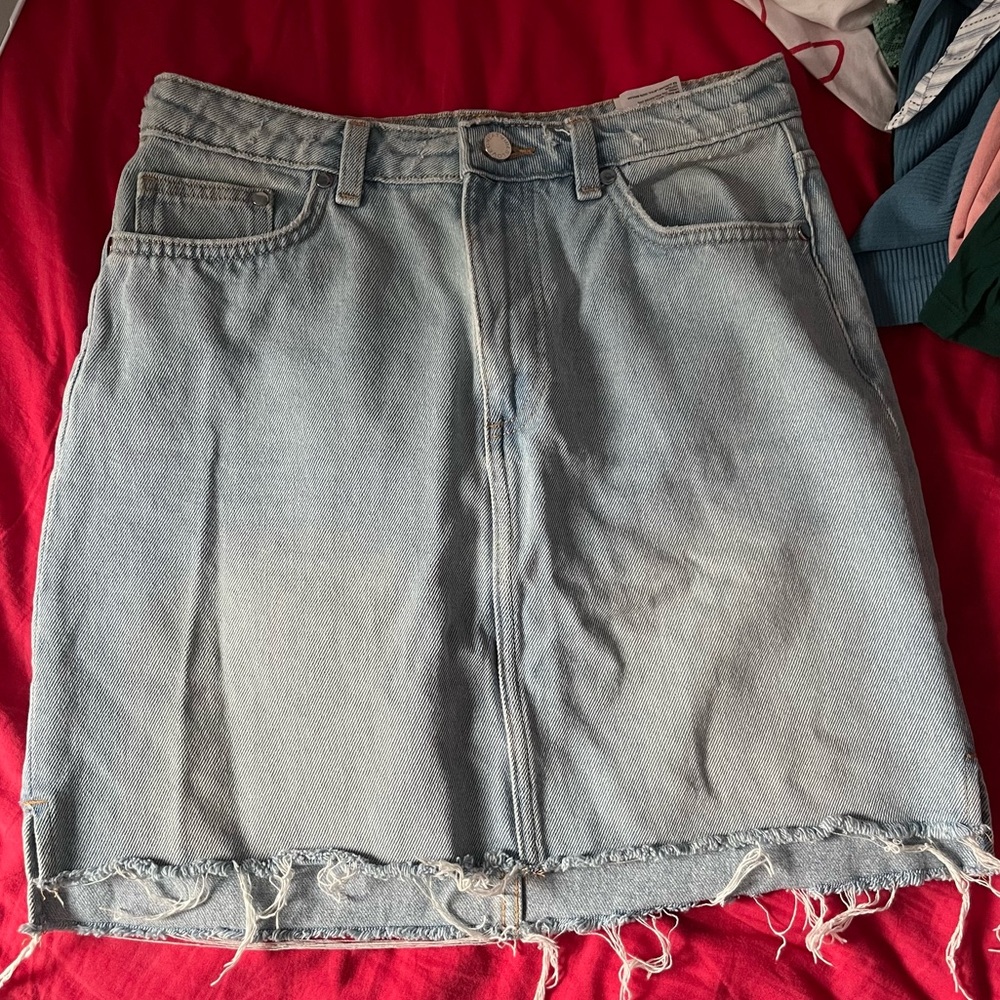 100% cotton raw hem light wash denim mini skirt